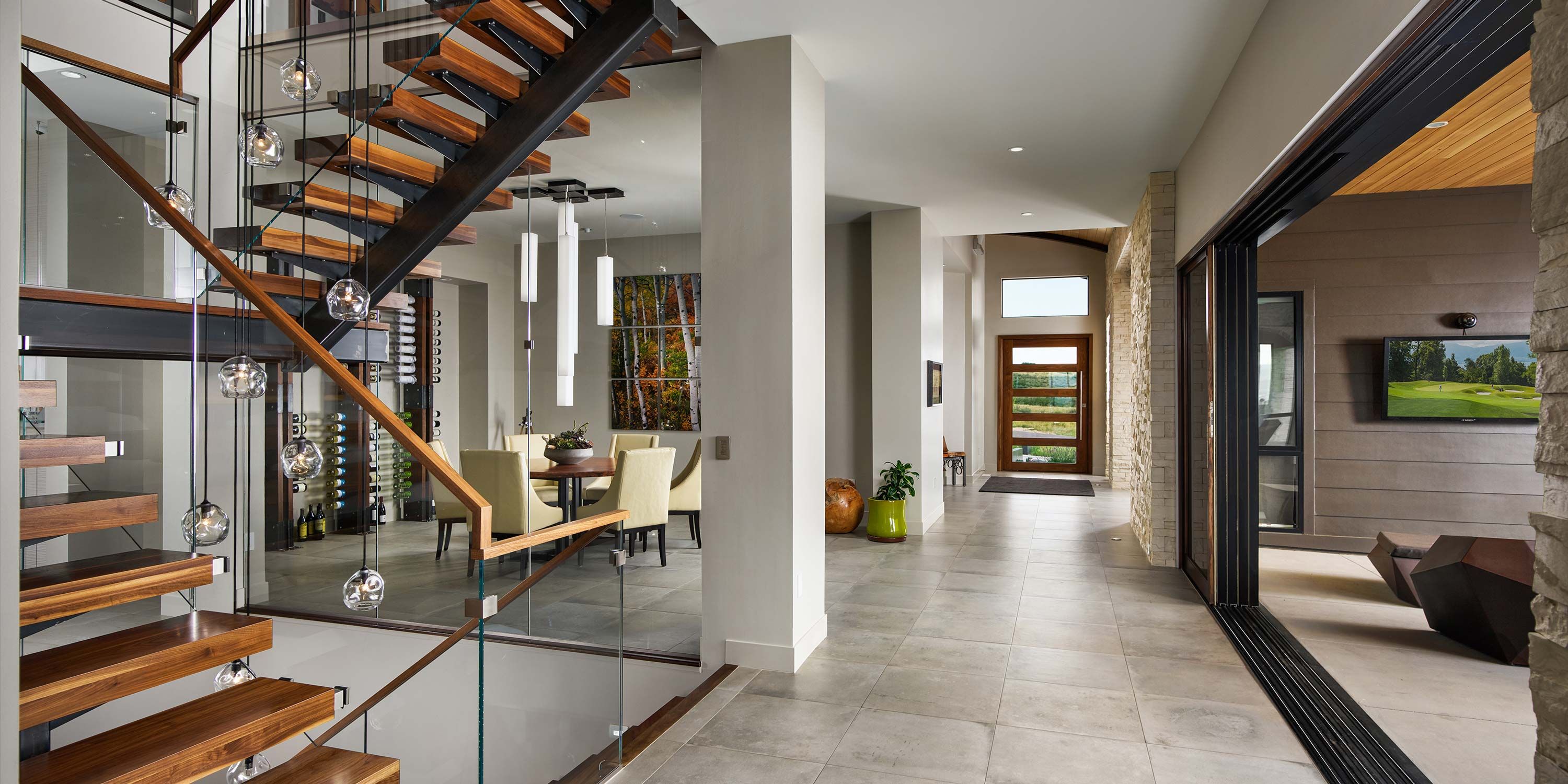 layout of grey walled home with wooden and metal stairs