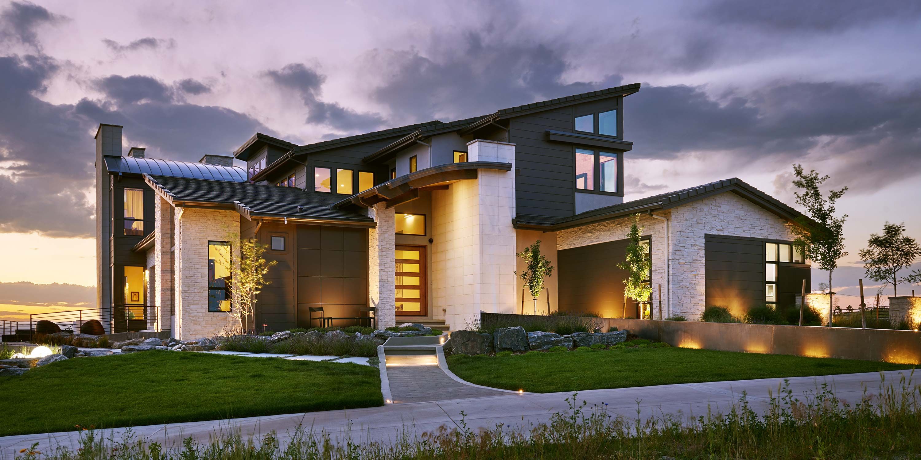 home lit up at dusk