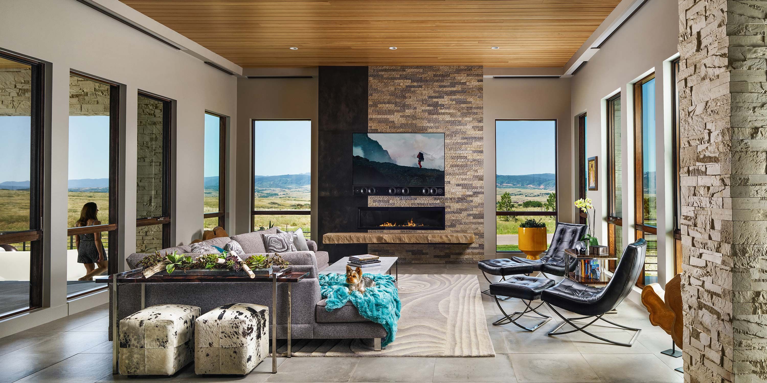 living room with large windows and wood ceilings